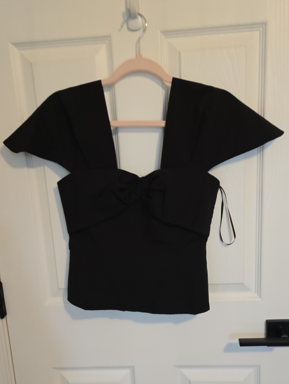 Elegant Black Bow-Front Crop Top with Structured Shoulders